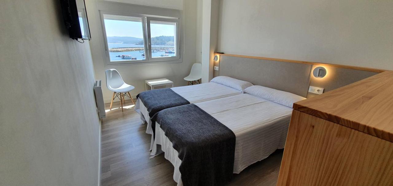 Apartamentos Costa Da Morte Muxia Exteriér fotografie A room at the hotel